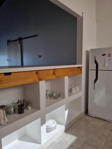 a kitchen with a counter and a refrigerator at Los Reales in Esquel