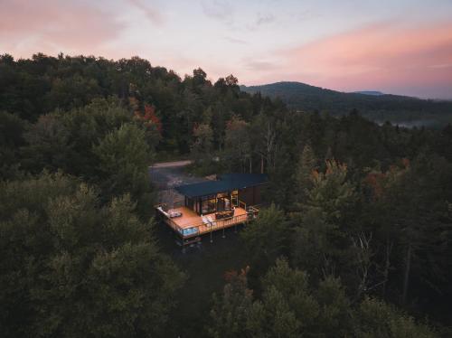 an aerial view of a house in the woods at Andas cabin CITQ#313550 in Lac-Superieur