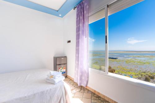Katil atau katil-katil dalam bilik di auberge Lacasa latifa vue sure mere moulay bousselham