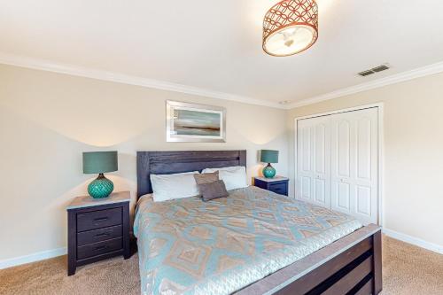 a bedroom with a large bed with two night stands at Cool in Kissimmee in Kissimmee