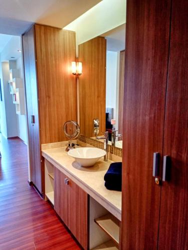 a bathroom with a sink and a mirror at Beautiful apartment in Plaza Residence Reforma in Mexico City