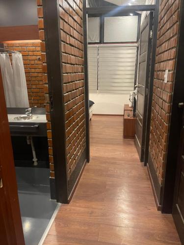 a room with a bathroom with a sink and a mirror at Onkel Inn Wagon Sleepbox Uyuni in Uyuni