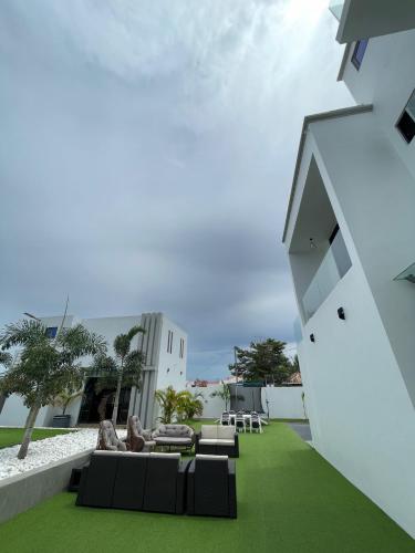 a living room with a couch and a building at Kibada White Villa in Dar es Salaam