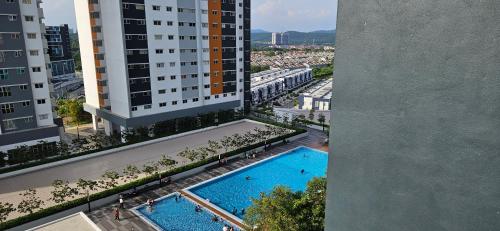 an overhead view of a swimming pool in a building at 2 Bedroom with Balcony Nearest KLIA in Sepang