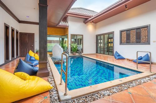 an indoor swimming pool in a villa at Asia Paradise Pool Villa, Jomtien Beach, Pattaya in Jomtien Beach