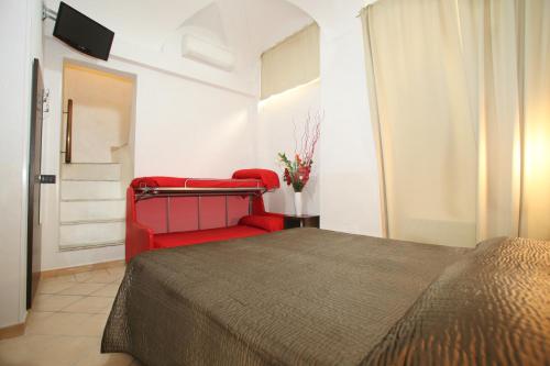 En eller flere senge i et værelse på Sakura Inn Sanremo