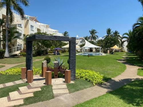 a sculpture in a park near a resort at Casa Puko in Acapulco