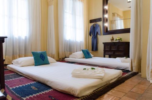 Katil atau katil-katil dalam bilik di Satri House Hotel