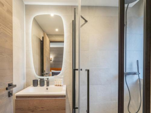 a bathroom with a sink and a shower at Charmant appartement neuf proche des pistes à Courchevel Le Praz, parking et wifi inclus - FR-1-568-45 in Courchevel