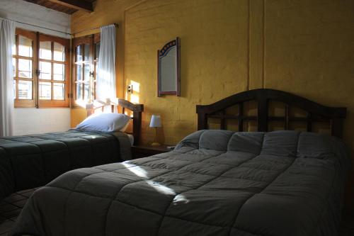 Postel nebo postele na pokoji v ubytování Posada Newen