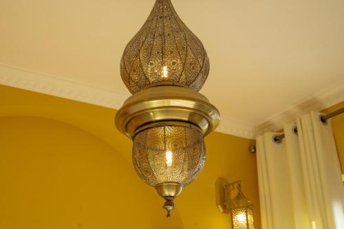 a chandelier hanging from a ceiling in a room at The Arabian Nights B&B in Chongqing