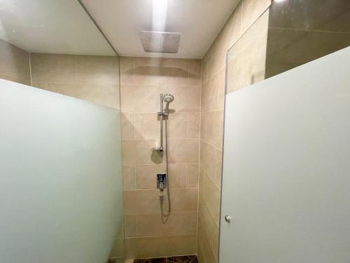 a shower with a glass door in a bathroom at Espana Condo Jomtien By AEY in Jomtien Beach