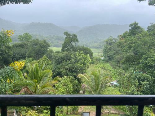 a view of a forest with mountains in the background at Eagles Eco Lodge - Kandy in Digana