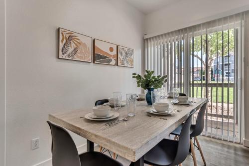 a dining room with a wooden table and chairs at Mountain View by Cloud Dream Homes in Clearfield