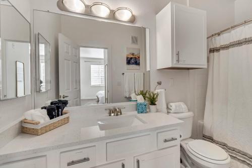a white bathroom with a sink and a toilet at Quality Apt Fast WiFi and Desk Davis Conference Center in Clearfield