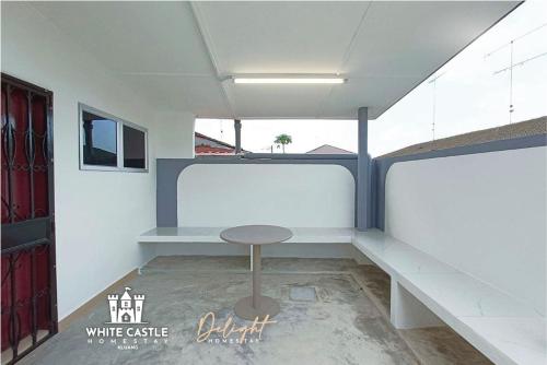 a small table in a room with a window at White Castle (Klg Baru) 11pax Semi-D Games/Neflix/Aeon in Kluang