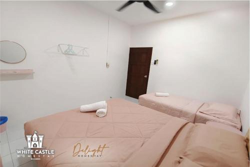 a bedroom with a large bed in a white room at White Castle (Klg Baru) 11pax Semi-D Games/Neflix/Aeon in Kluang