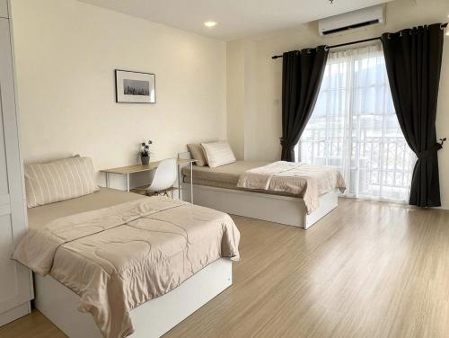 Postel nebo postele na pokoji v ubytování Cozy Suite - Near UTAR - Champs Elysees Kampar