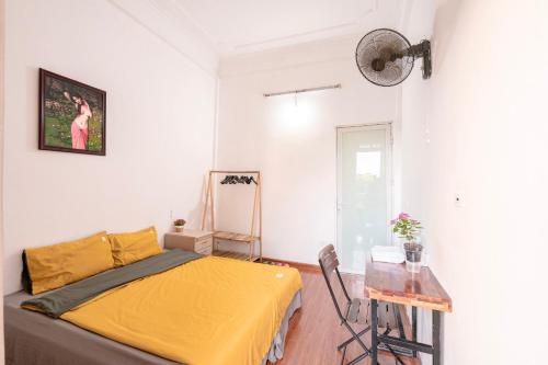 Ένα ή περισσότερα κρεβάτια σε δωμάτιο στο Tam An HaNoi Homestay