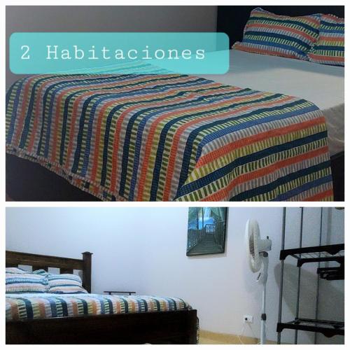 a bedroom with a bed with a colorful blanket at Villa Chungos in Quebrada Ganado