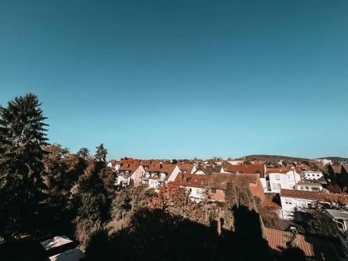 a town on top of a hill with houses at Hotel Bayerischer Hof in Bad Kissingen