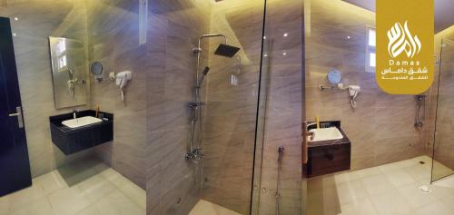 a bathroom with two sinks and a shower at داماس للأجنحة الفندقية Damas Hotel Suites in Al Maraghah