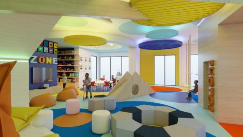 a childrens play area in a library with people in it at Dreams Estrella del Mar Mazatlán Golf & Spa Resort in Mazatlán