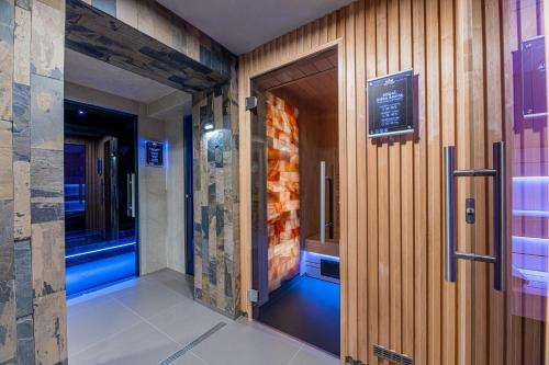 a corridor of a building with a door and a window at Wellness Penzión Vila Mery in Poprad