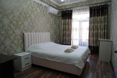 Krevet ili kreveti u jedinici u okviru objekta Nice and comfortable apartment in the downtown of Bishkek