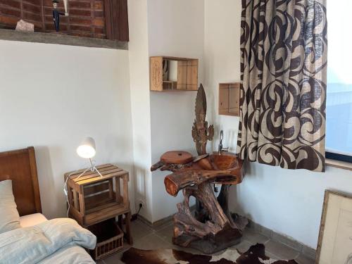 a room with a bed and a table and a tv at Loft by Conceptliving in Kortrijk