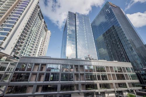 a group of tall buildings in a city at Metropole Thu Thiem Condo Apartment in Ho Chi Minh City