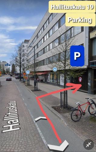 a bike parked on the side of a street at 4-roomIIPerfect locationIICenter in Oulu