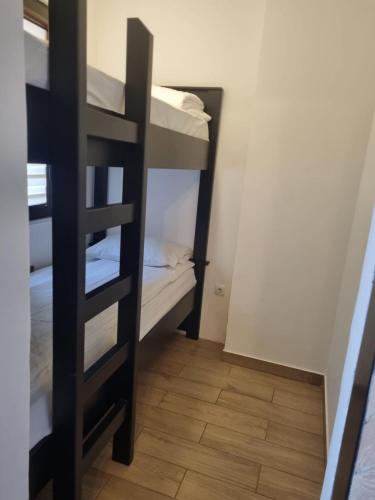 a small room with a bunk bed and a staircase at Jahorinski IZLOG in Jahorina