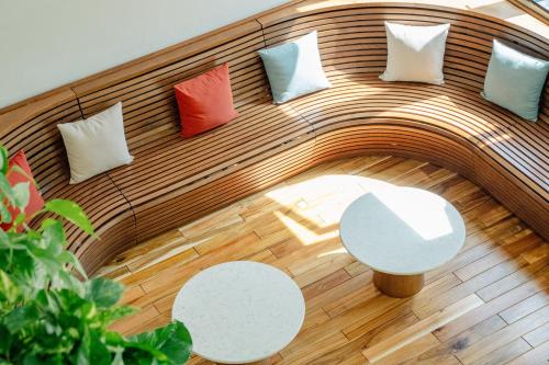a group of pillows and tables in a room at Pax Ana Doc Let Resort & Spa in Ninh Hòa