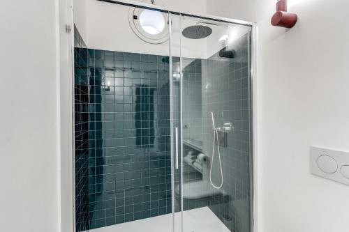 a bathroom with a glass shower with a toilet at Villa Giulia Boutique Views Pool and Guest Services by Feeling Italy in Sorrento