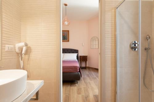 a bathroom with a shower and a sink and a toilet at Queen Meg Roma in Rome