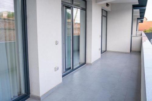 an empty hallway of a building with windows at BB Residence in Arad