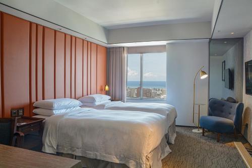 Postel nebo postele na pokoji v ubytování Sheraton Taitung Hotel