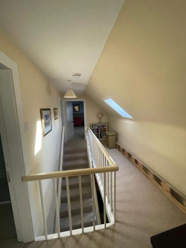 a staircase in a house with a stair case at The Fiddichside Inn in Aberlour