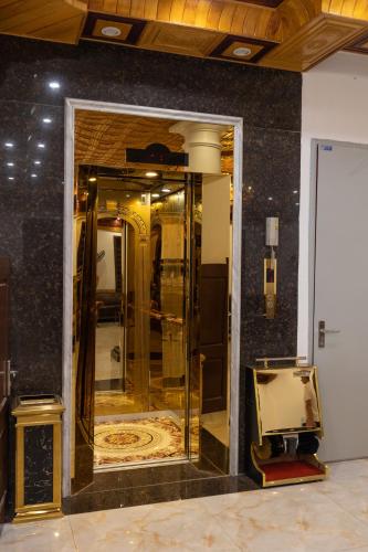 a mirror on a wall in a room at Royal Hotel Sài Đồng - Long Biên in Hanoi