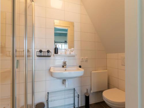 een badkamer met een wastafel en een toilet bij 2 modern renovated apartments in the heart of Sneek in Sneek