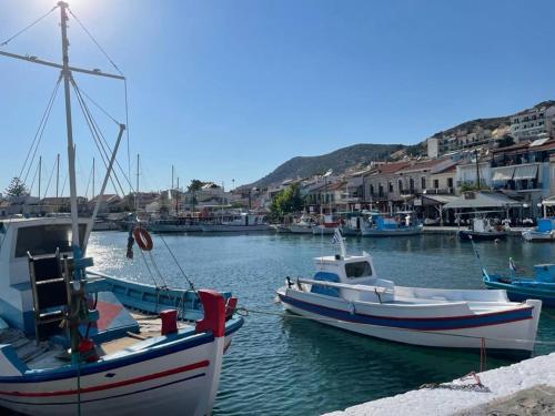 a group of boats docked in a harbor at Manus Dei Exclusive Suites in Pythagoreio