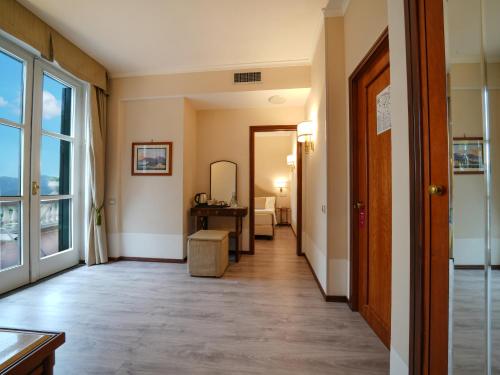 a hallway of a hotel room with a mirror at Hotel Scapolatiello in Cava deʼ Tirreni