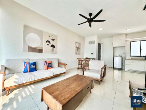 a living room with a couch and a ceiling fan at Macrolink Medini by RR JBcity in Nusajaya