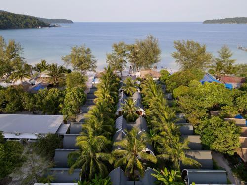an aerial view of a resort with palm trees and the ocean at Eden Beach Resort By EHM in Koh Rong Sanloem
