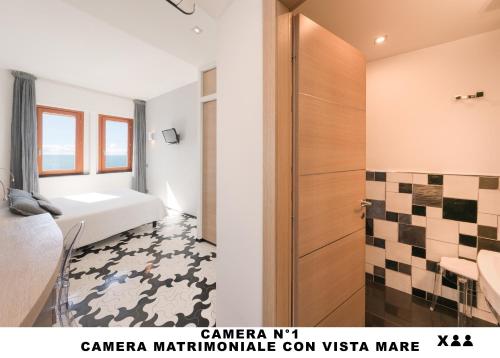 Katil atau katil-katil dalam bilik di Affittacamere Lo Scoglio (Guesthouse)