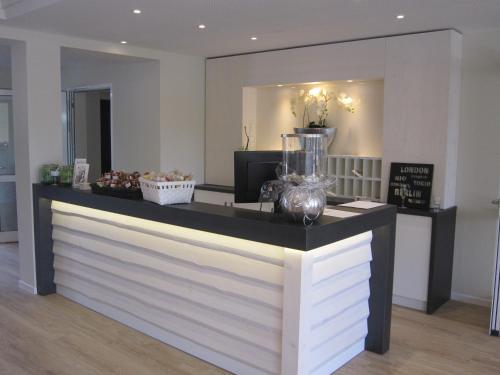 a counter in a store with a vase on it at Landhotel zum grünen Kranze in Espelkamp-Mittwald