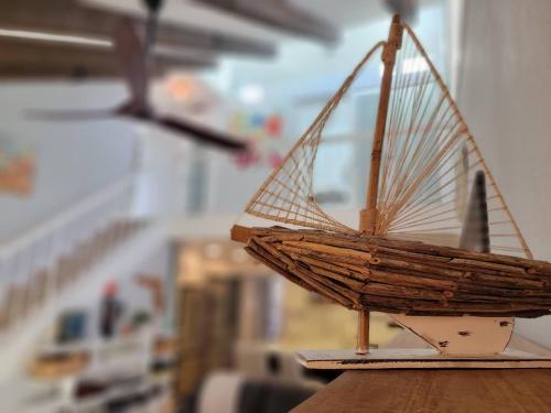 a model of a boat sitting on top of a table at Sneaky Tiki: Heated Saltwater Pool+5 min to beach in Largo
