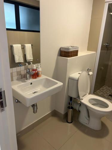 a bathroom with a toilet and a sink at Apartment in Umhlanga in Umhlanga