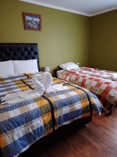 Katil atau katil-katil dalam bilik di Casa Salkantay Cusco